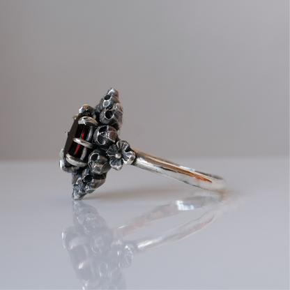 PATES garnet halo ring