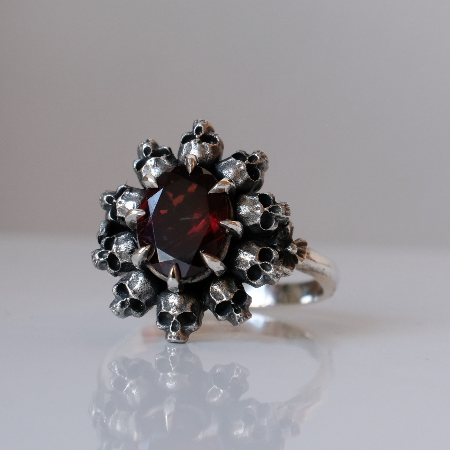 PATES garnet halo ring